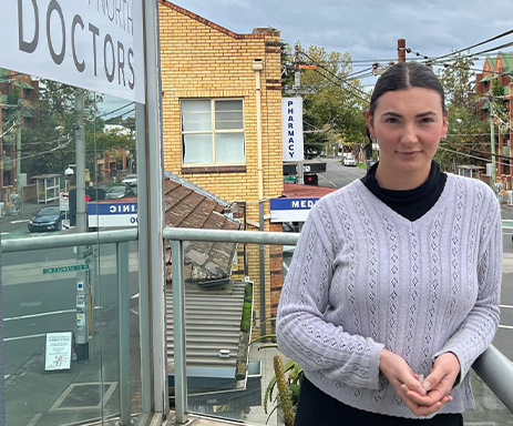 Kat-Heffernan, our lovely enrolled nurse at Fitzroy North Doctors GP clinic, standing on the clinic terrace. Book an appointment with our friendly supportive nurse NOW!